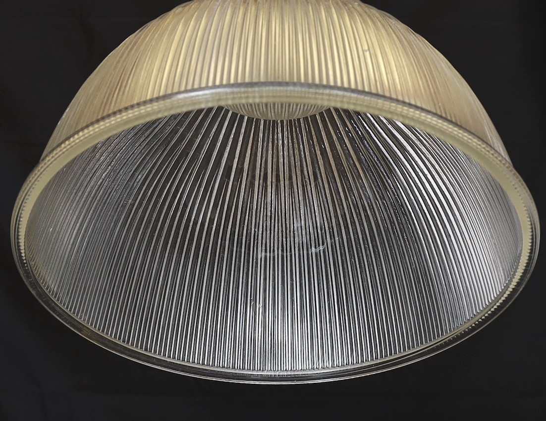 A pair of industrial style chrome plated ceiling lights with ribbed glass shades, signed Endural, diameter 46.5cm. height 50cm